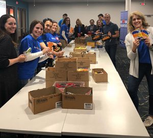 BMO volunteers packing boxes at BMO volunteer day 2019