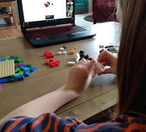 A child plays with LEGO bricks
