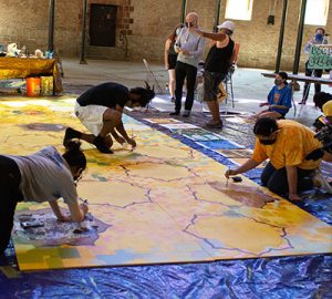 Students creating a mural