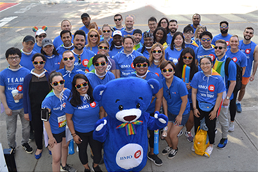 Employees with BMO the Bear mascot