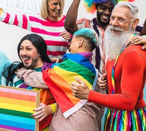 Pride revellers in colourful costumes