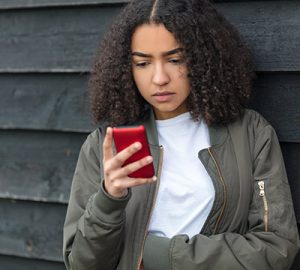 A girl checks her cellphone