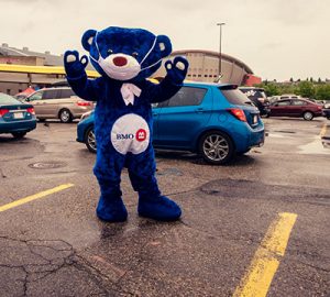 BMO Bear wearing a mask as he waves