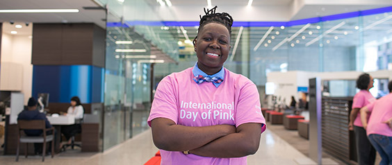 A woman wearing a pink International Day of Pink t-shirt